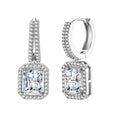 Sterling silver huggie hoops with emerald-cut moissanite drops featuring pavé-set crystals on white background.