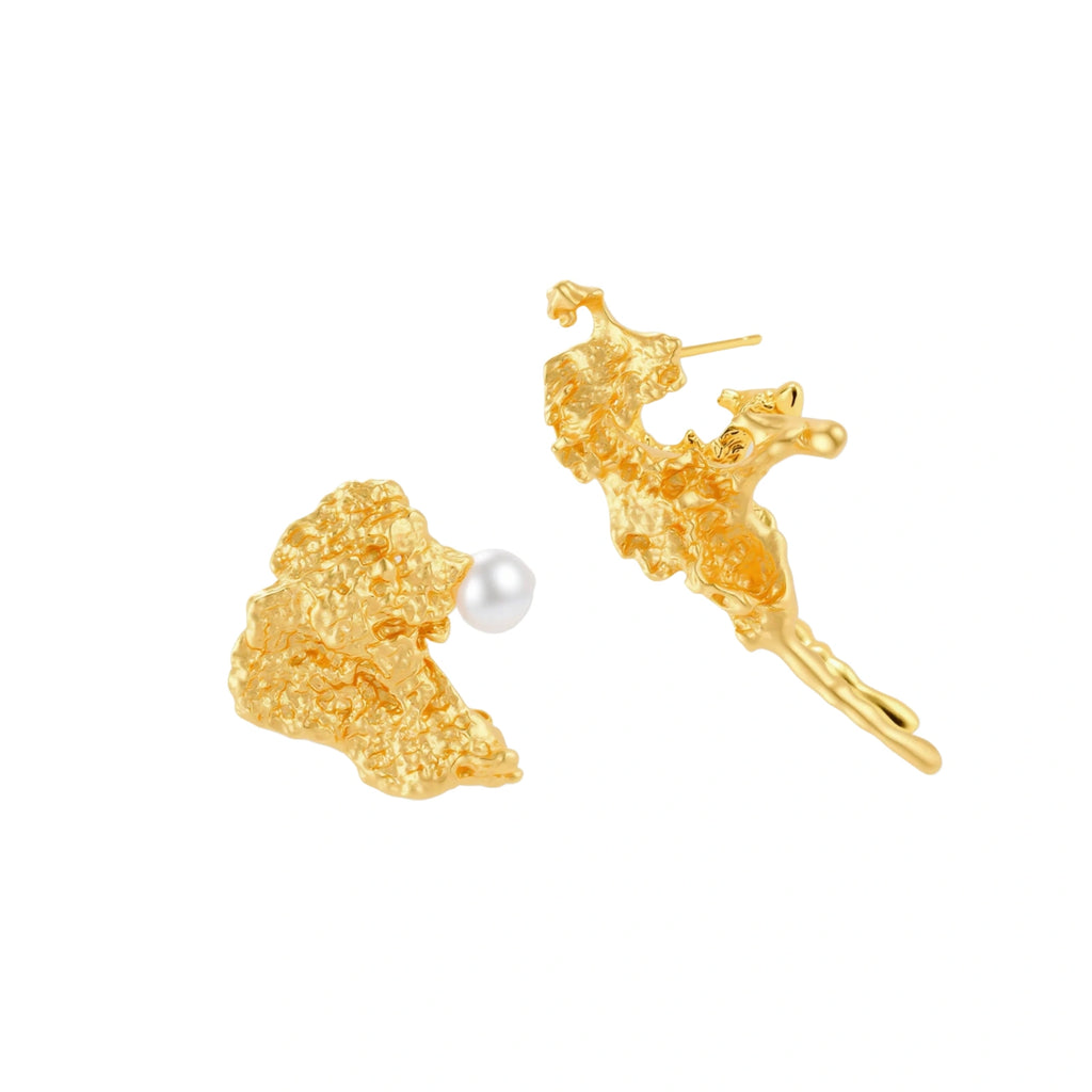 Textured gold stud earrings with coral-like organic surface, one featuring a freshwater pearl, displayed on white background.