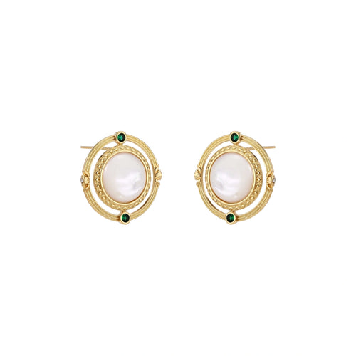 Circular gold stud earrings with iridescent mother-of-pearl center and green zirconia accents on cream background.