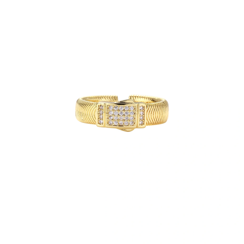 Gold-plated adjustable ring with ribbed band and rectangular pavé cubic zirconia panel on white background.