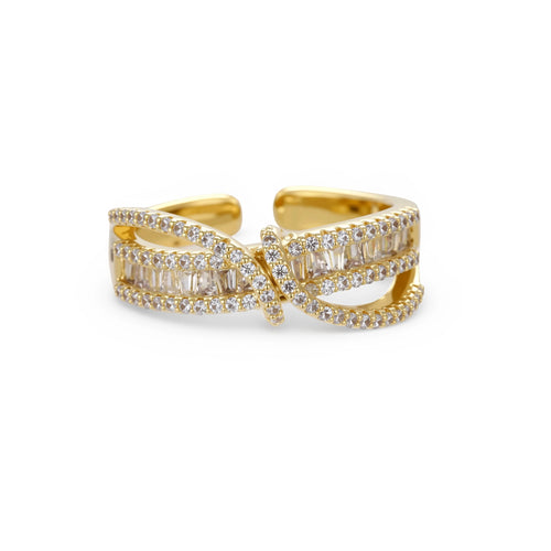 Close-up of gold-plated adjustable ring with crossing bands and sparkling zirconia stones on white background.