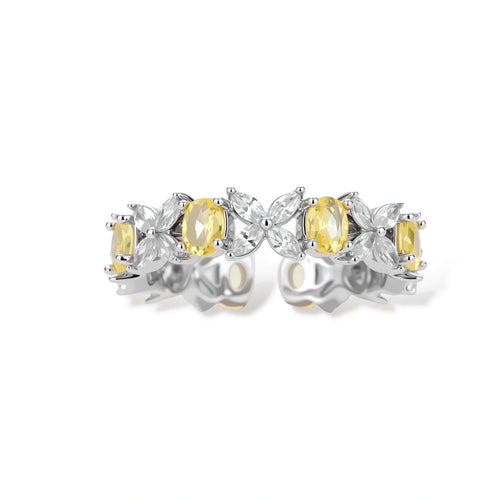 Close-up of platinum-plated copper eternity ring featuring alternating yellow and clear marquise-cut stones in elegant band setting.