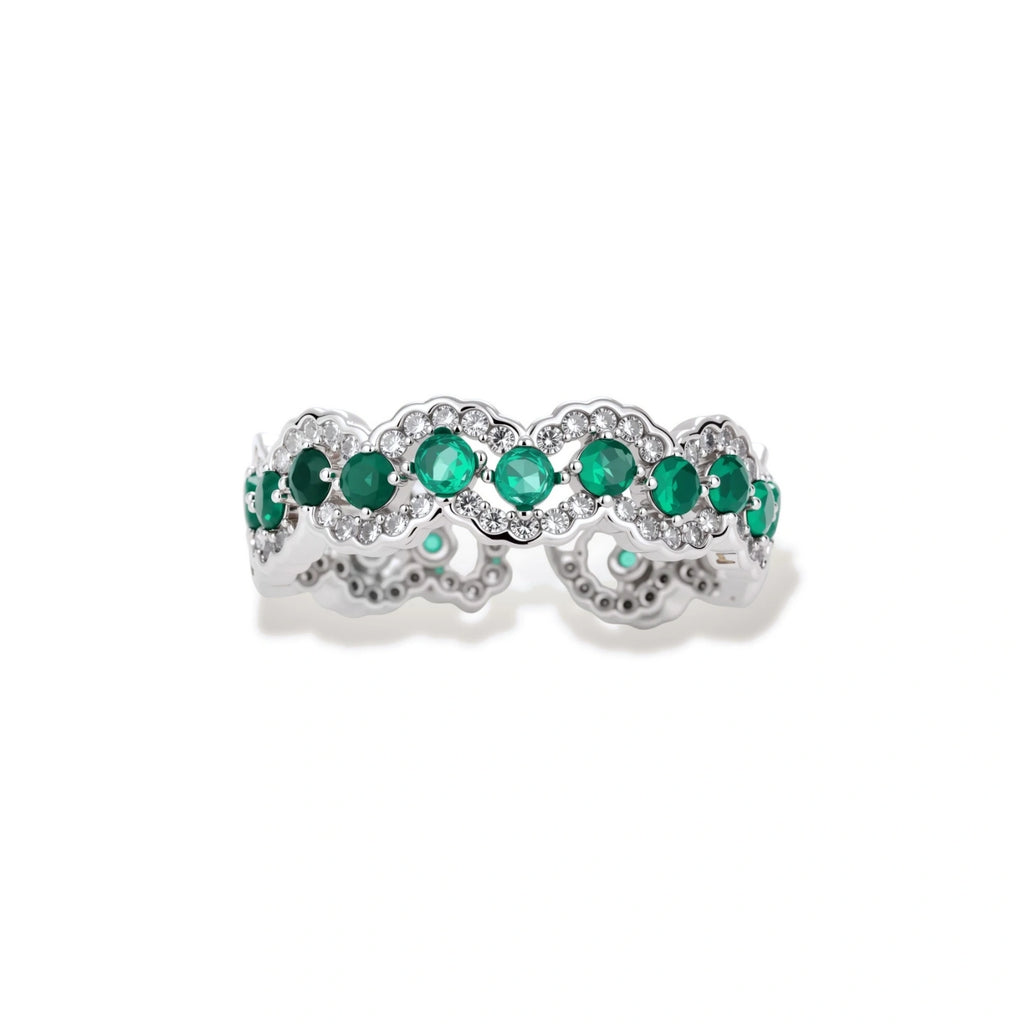 Platinum-plated copper ring with green zirconia stones in decorative scalloped wave pattern, adjustable band design.
