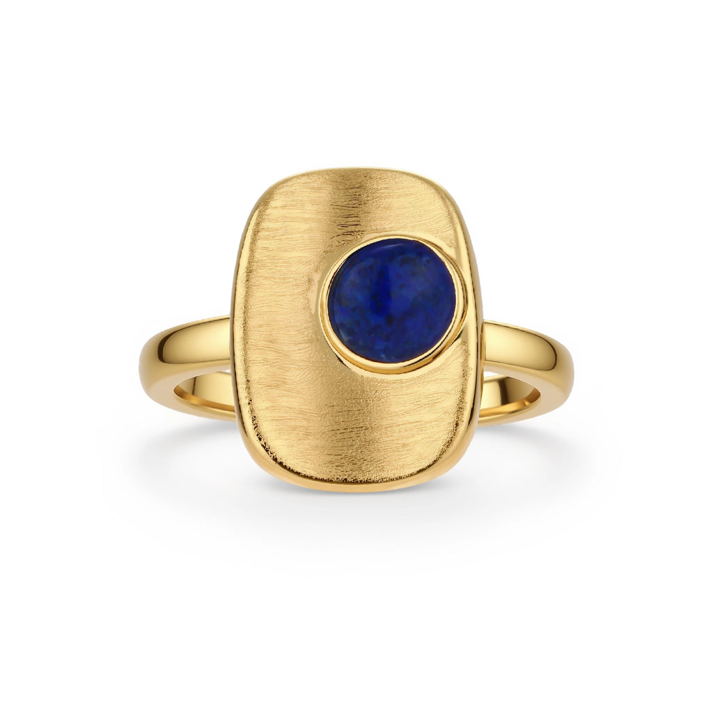 Adjustable gold-plated ring with textured square setting featuring a round blue lapis lazuli stone on cream background.